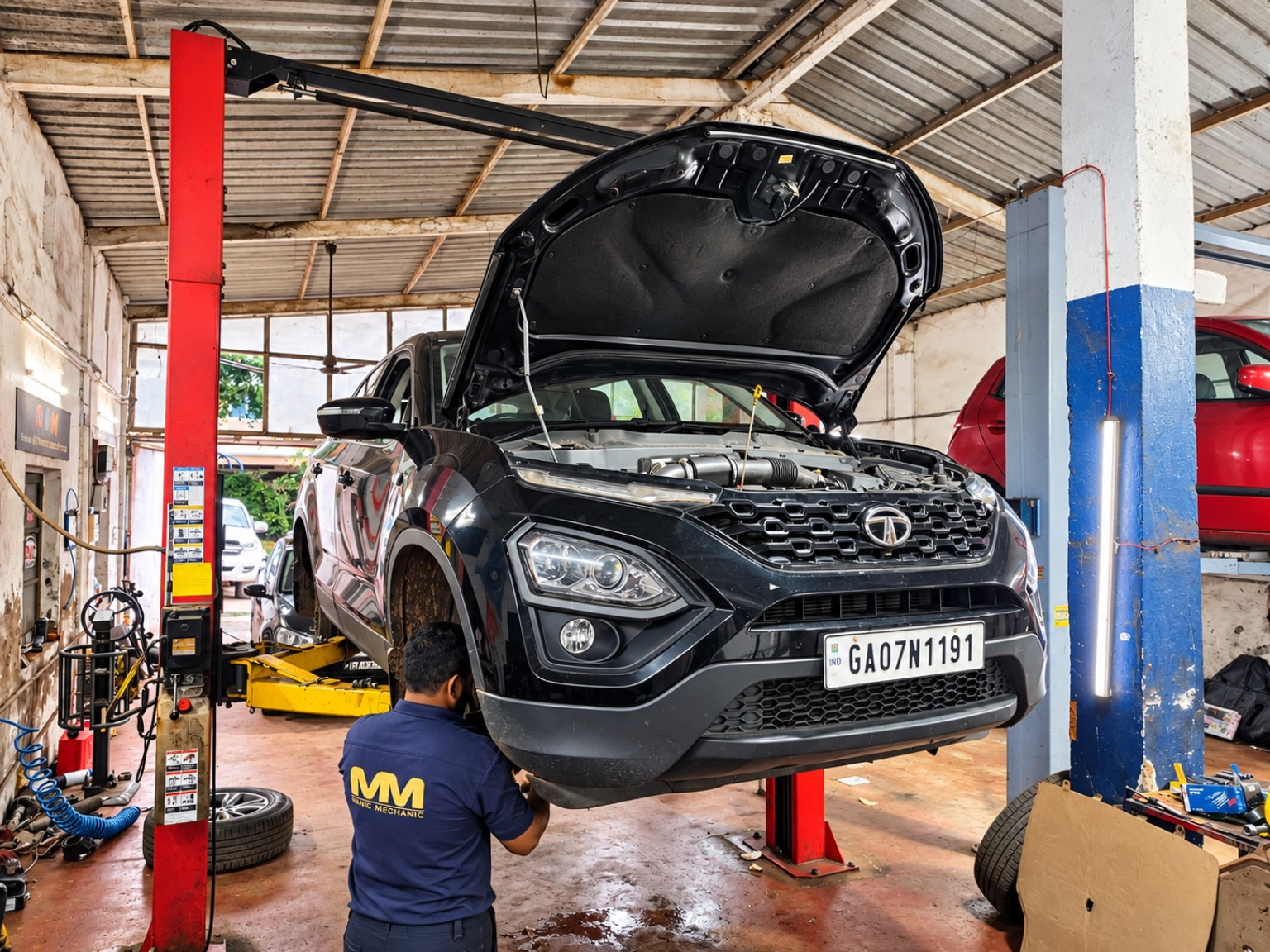 Tata SUV on a lift at Manic Mechanic Goa